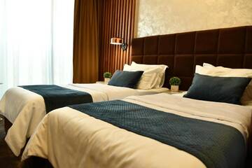 Фото номера Двухместный номер Делюкс с 2 отдельными кроватями Отель Quartz Boutique Hotel г. Мамая 3